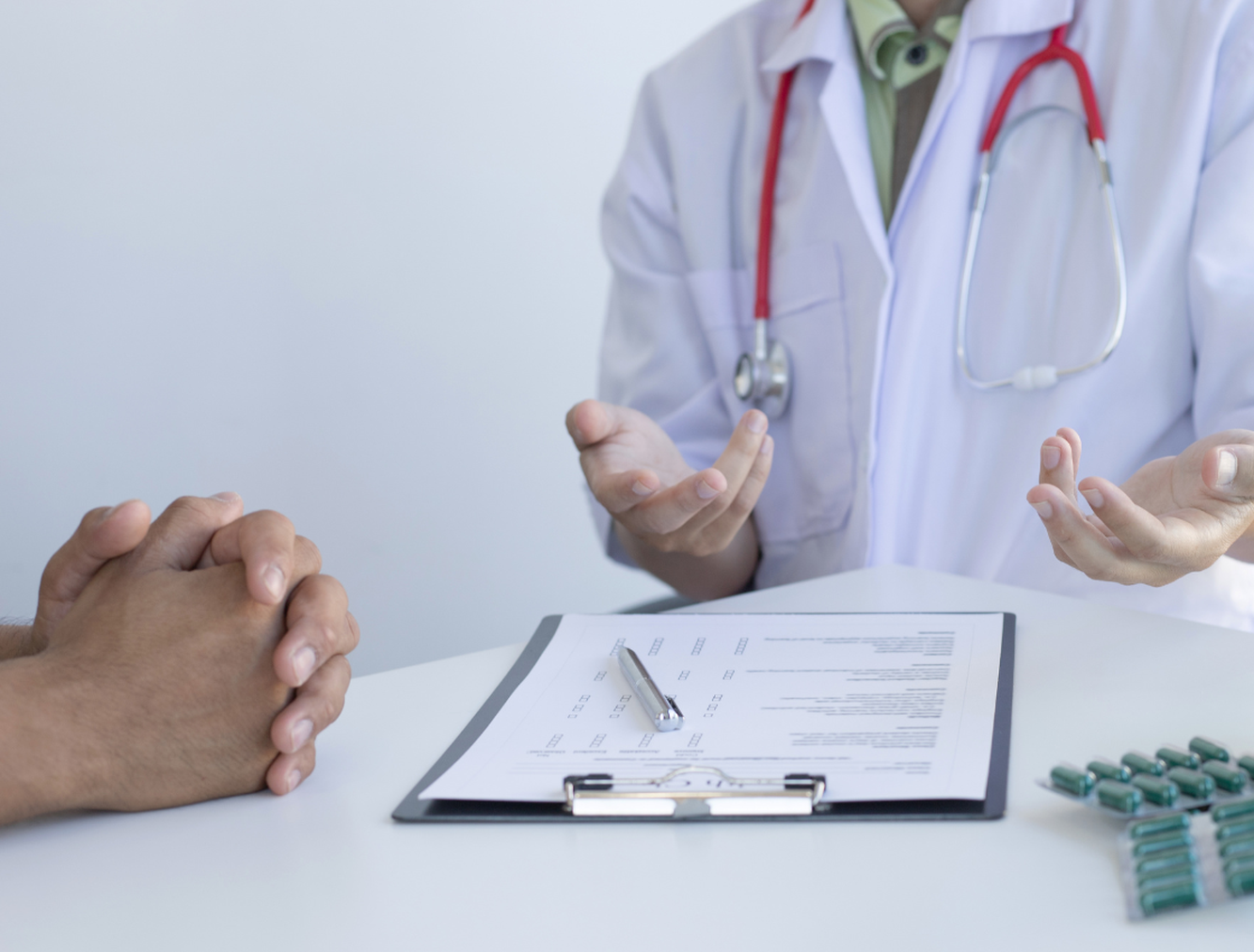 A man receiving a diagnosis from a medical consultant