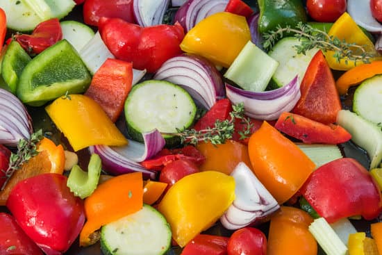 platter of healthy vegetables including courgettes, onions, peppers and more