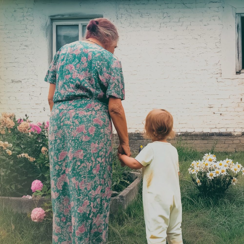 Grandparent and grandchild holding hands in a flowery garden