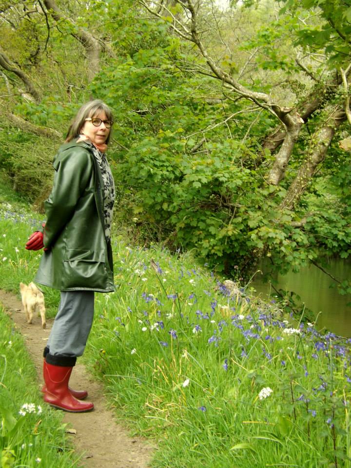 Heather's story. Person standing in meadow.