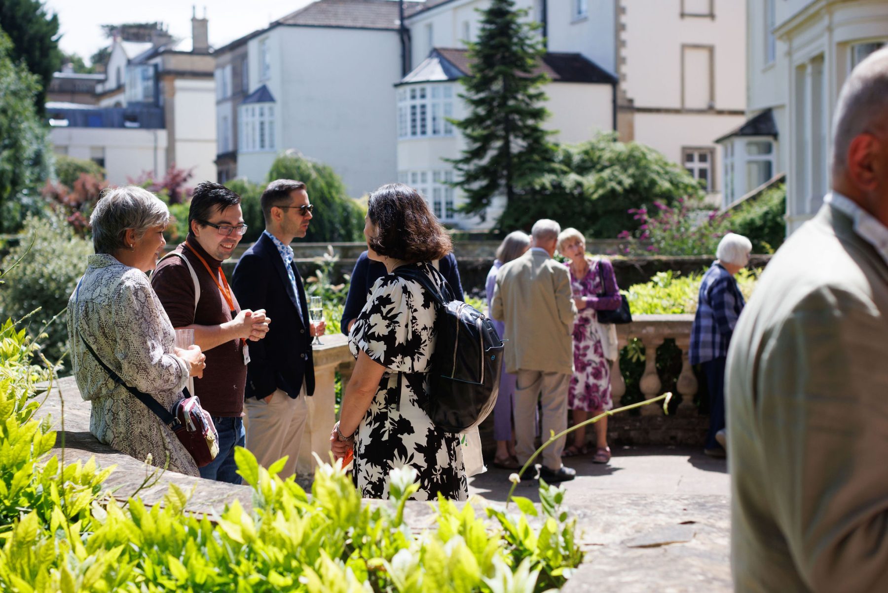 party for 40 years of Sight Research UK event, guests mingling outside in sunshine