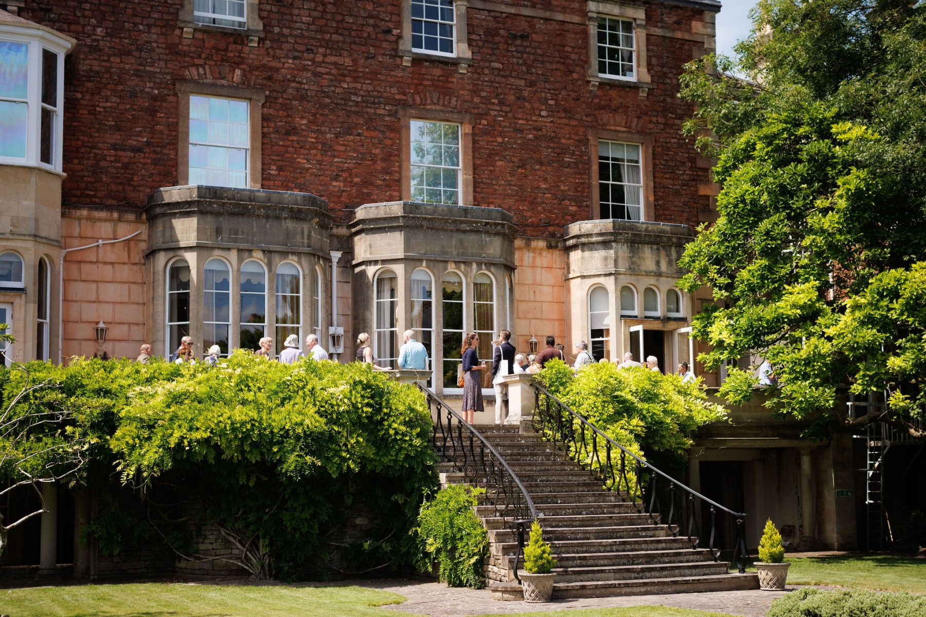 Guests milling outside Merchants' Hall in Bristol