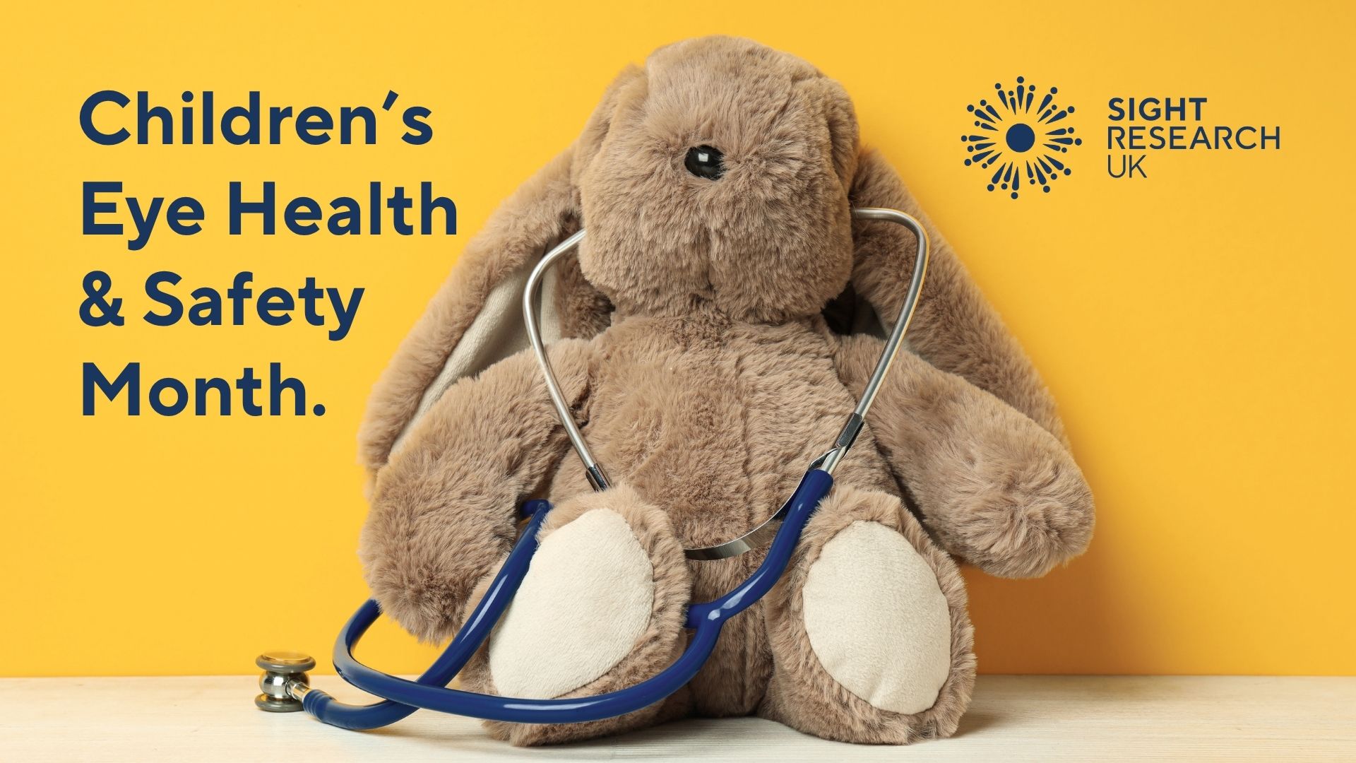 rabbit next to blue text saying 'Children's eye health and safety month'